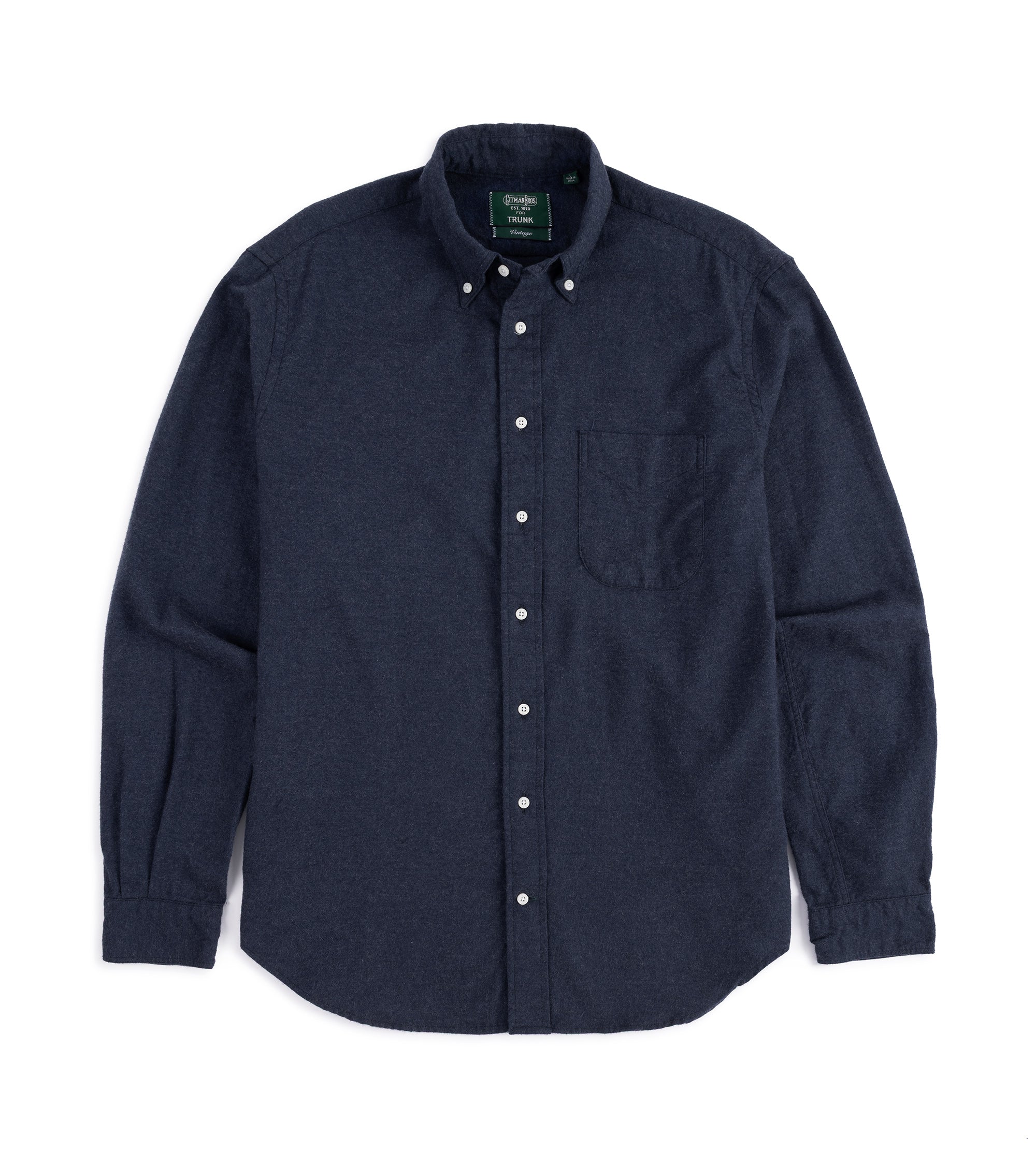 Navy button-up shirt with white buttons on a white background