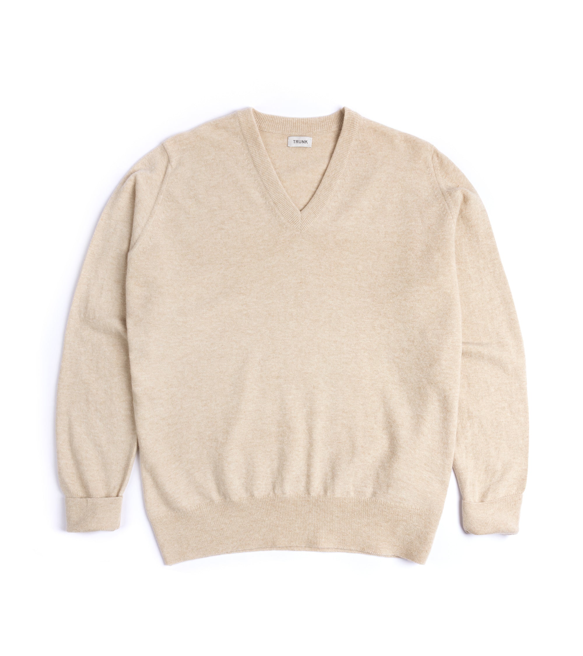 Beige sweater on a white background